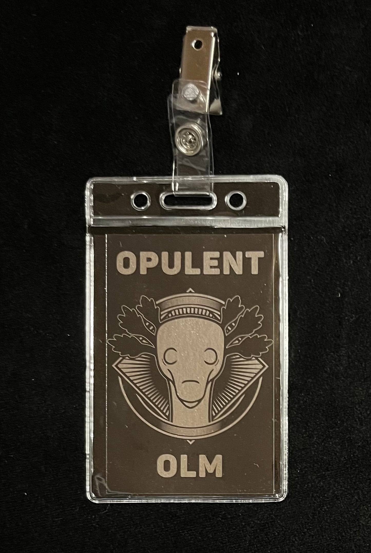 Opulent Olm Badge